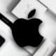 apple logo with apple products blurred in the background