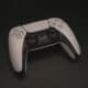 playstation 5 controller on table dualsense