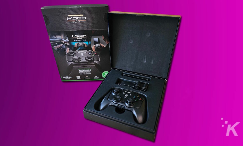 MOGA XP-Ultra game controller with packaging on purple background.