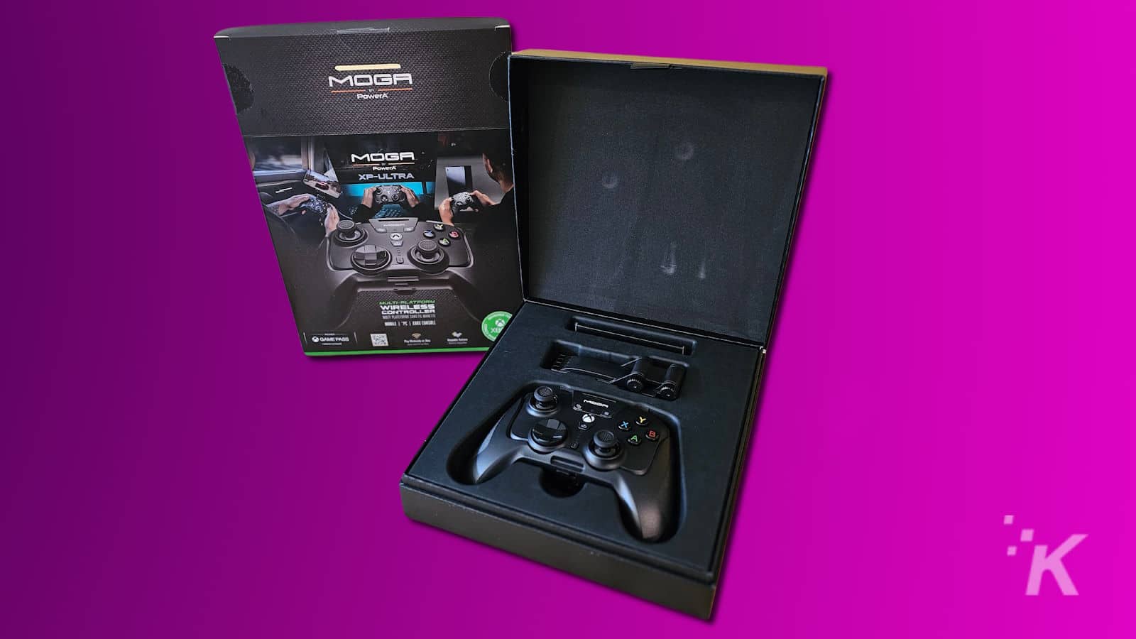 MOGA XP-Ultra game controller with packaging on purple background.