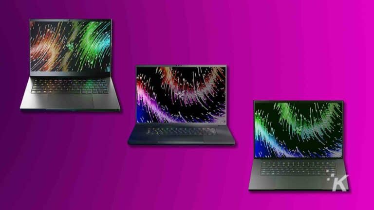 Three laptops with colorful screen savers on purple background.