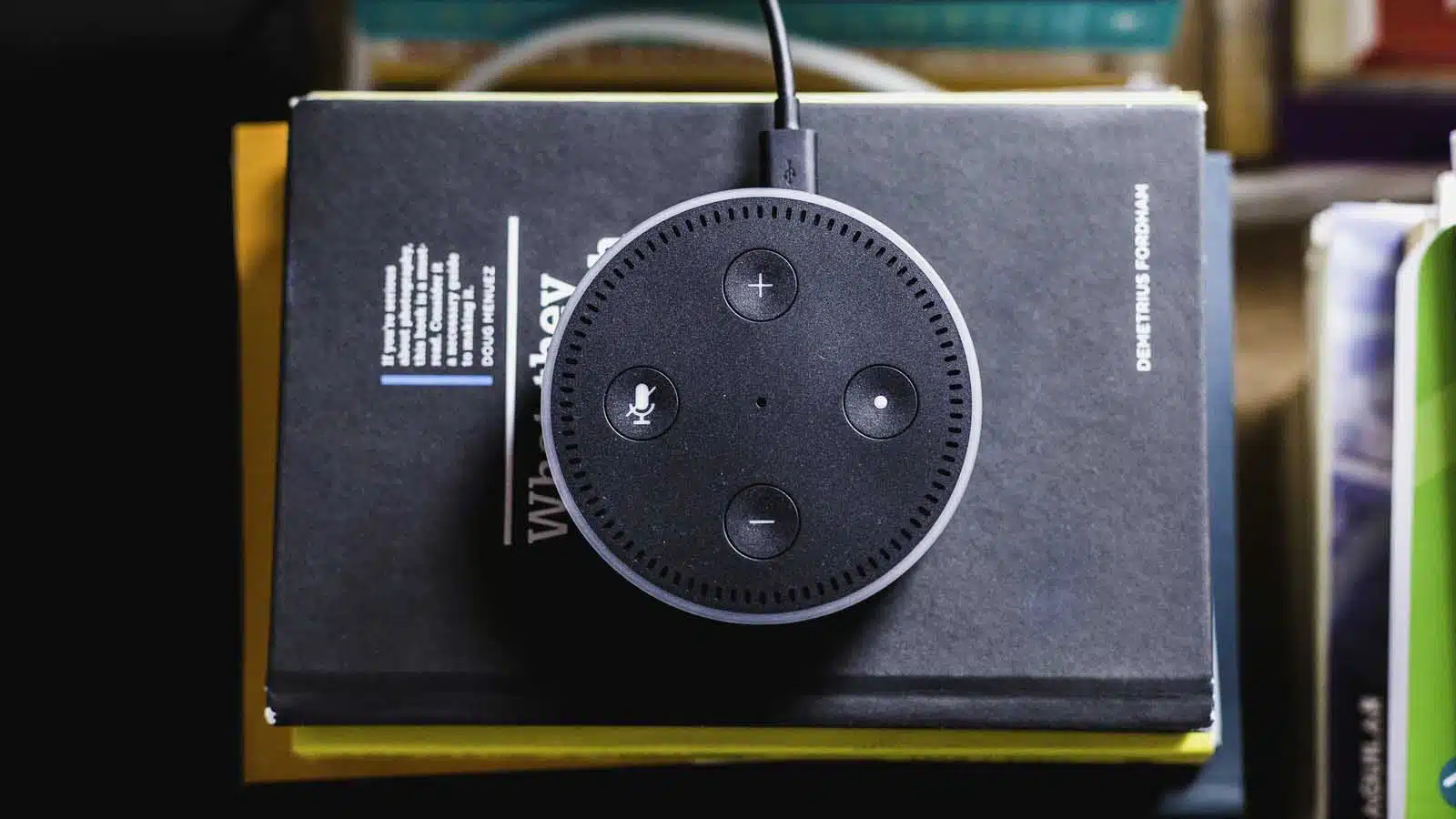 amazon echo with alexa placed on books