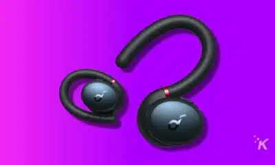 Anker's Soundcore Sport X10 earbuds on purple background