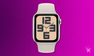 render of an apple watch se 2nd gen in starlight on a purple background