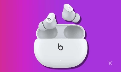 white beats studio buds on a purple background