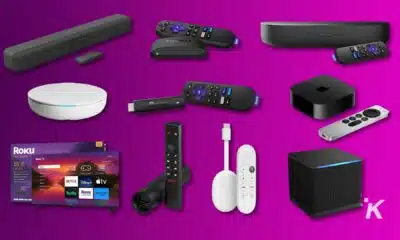 Various streaming devices and remotes on purple background.