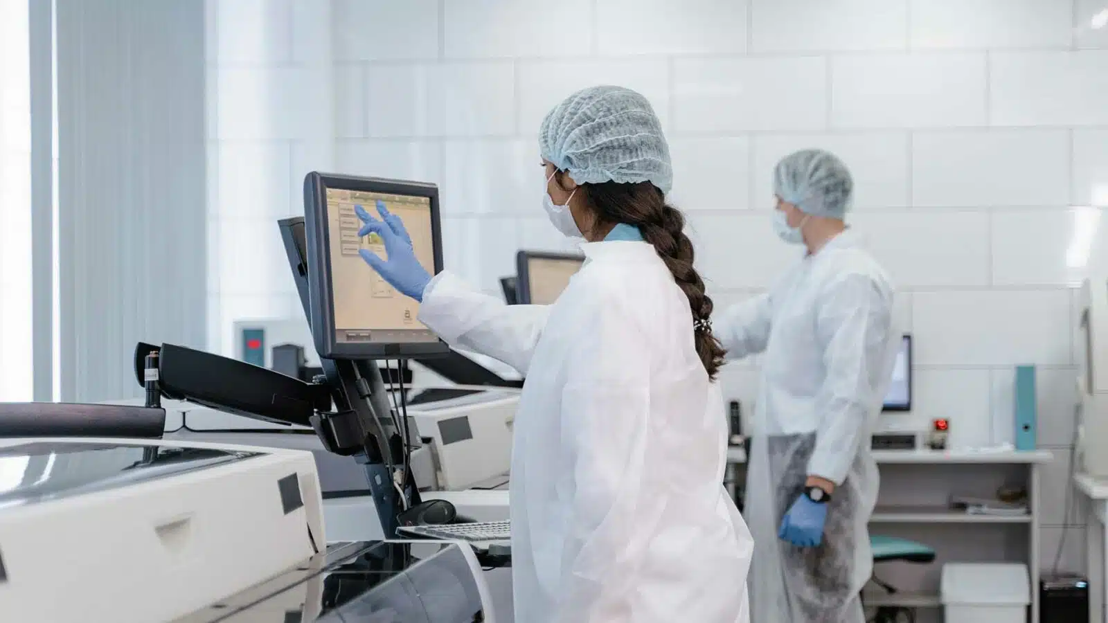 Scientists using technology in modern laboratory biotechnology