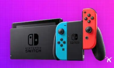 Nintendo Switch console with neon blue and red controllers.