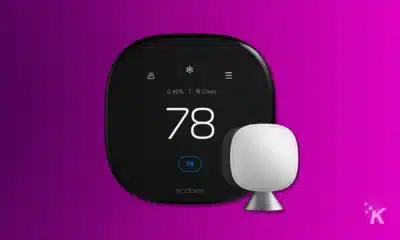An ecobee smart thermostat displaying 78 degrees with humidity and air quality indicators, alongside a white sensor, against a purple background.