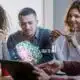 EssayAI on laptop with students
