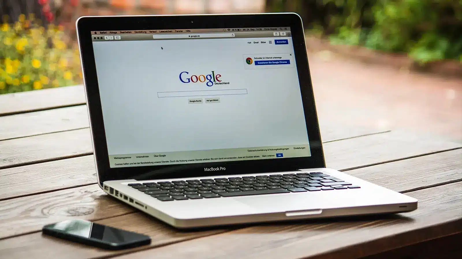laptop with Google on the screen on a table