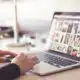 person uploading photos on laptop