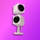 Two white security cameras stacked vertically against a vivid purple background. They have prominent lenses and appear modern. A subtle logo in the corner.