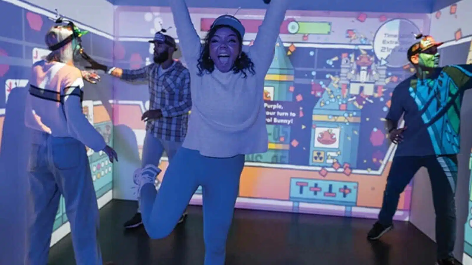 Friends enjoying a vibrant virtual reality game room.