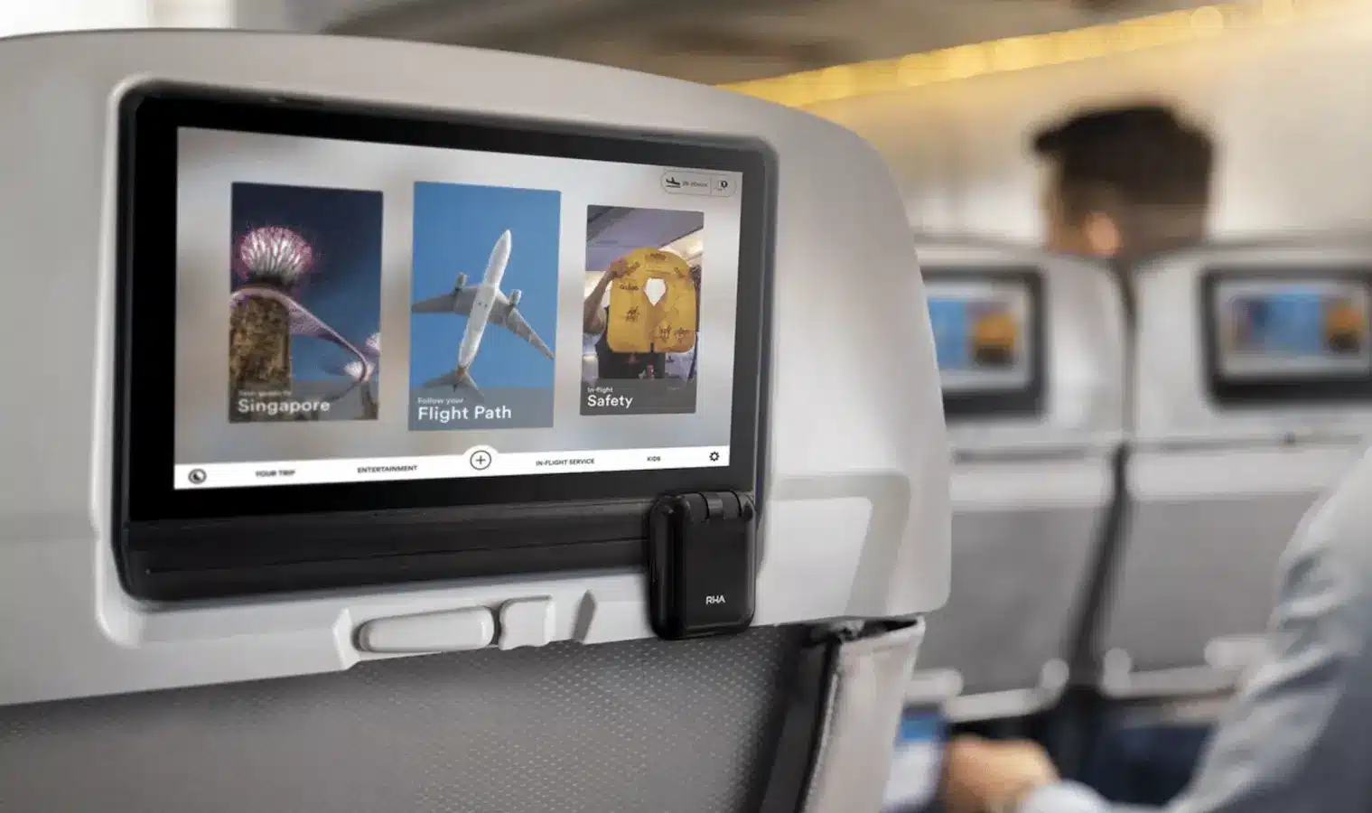 person using an inflight entertainment system