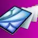 Four new iPad Air with sleek designs on purple background.