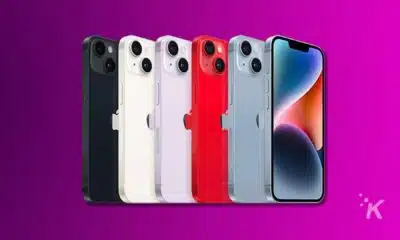 Colorful smartphones displayed on purple background.