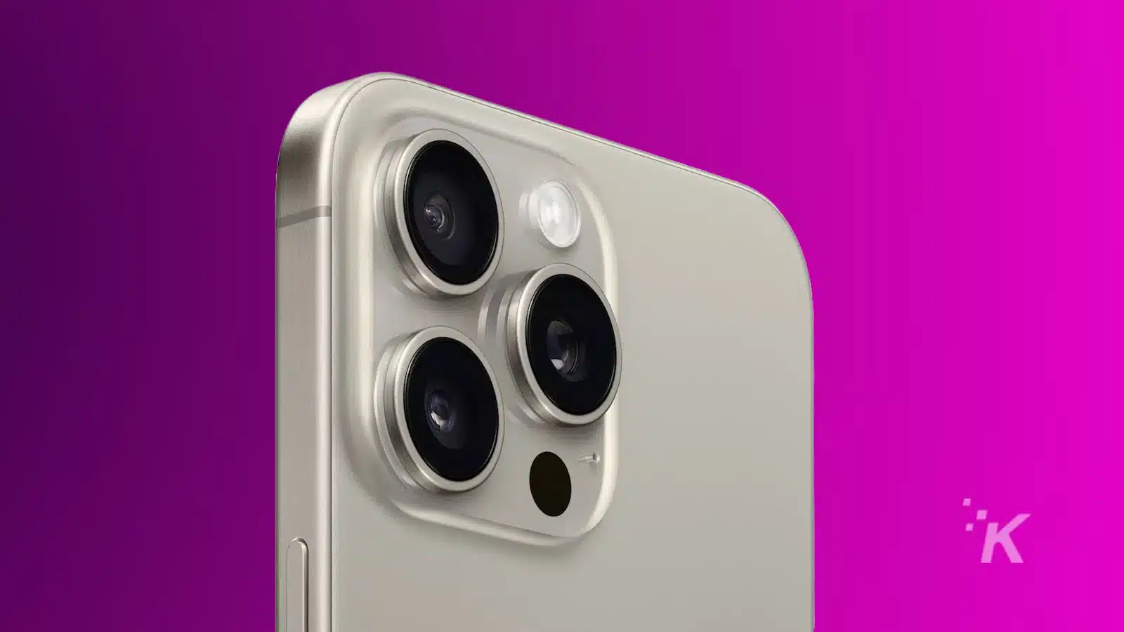 Close-up of a modern smartphone's triple camera system on a silver backing, with a purple background.