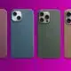 Four iPhones in different colors on purple background.