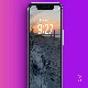 iPhone lock screen with picture of a sunset at the beach.