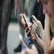 kids on smartphones playing games