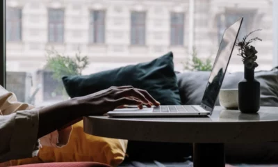 person typing on a laptop