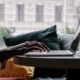 person typing on a laptop