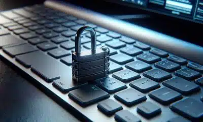 Laptop with Lock on top of the keys.