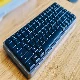 A lowfree flow mechanical keyboard sits on the table.
