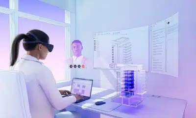 Woman using virtual reality for architectural design.