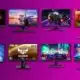 Variety of gaming monitors on purple background.