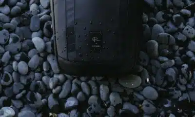 nomatic camera backpack on pebbles