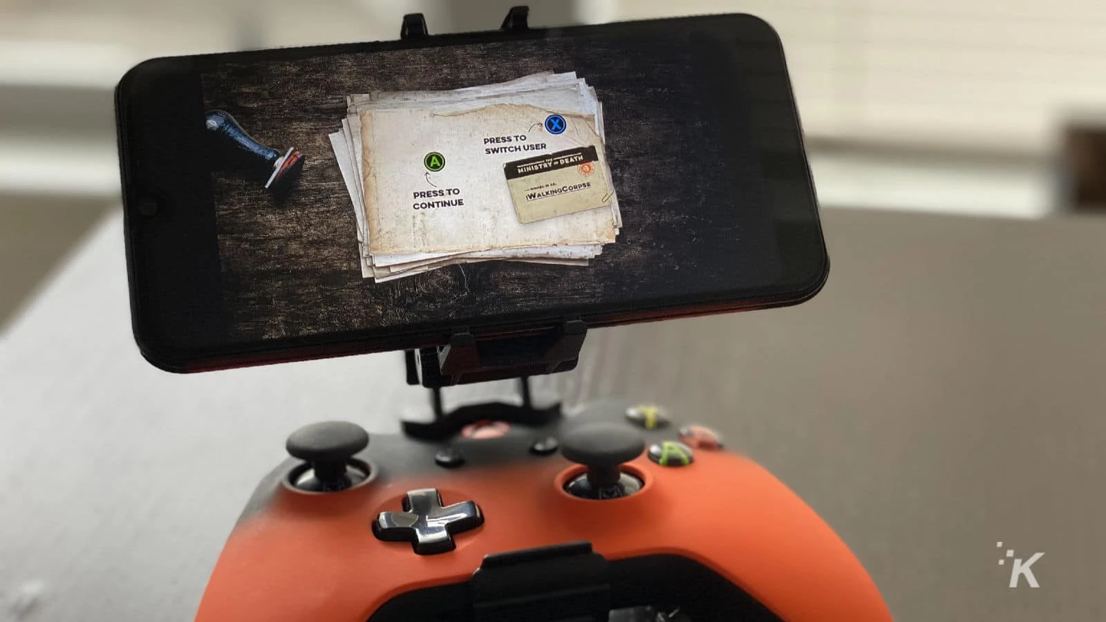 xbox cloud gaming service on a smartphone that is attached to a controller