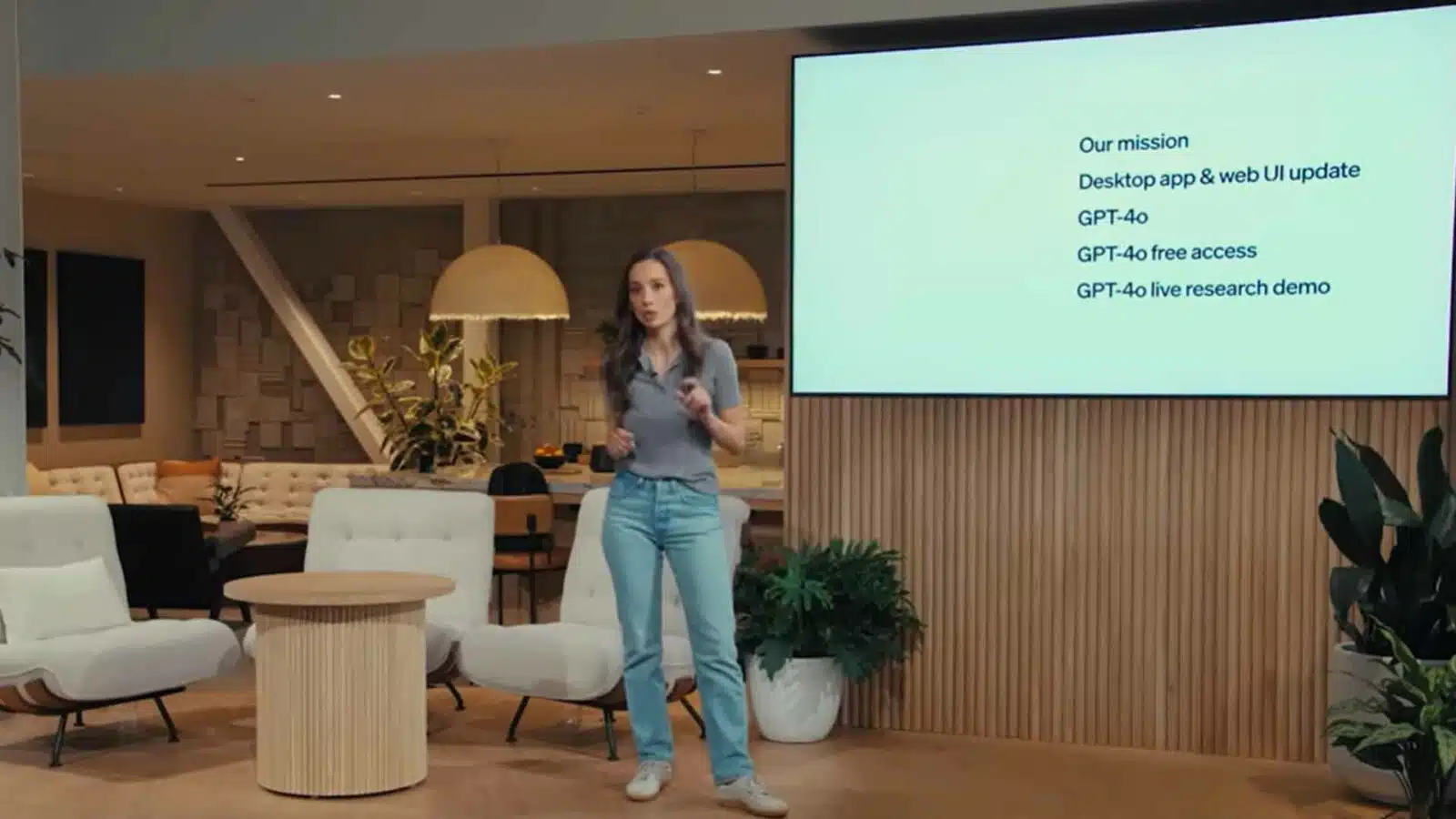 Woman presenting AI technology update in modern office.