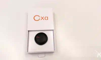 Oxa branded device in open packaging on white table.