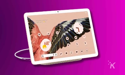 A cartoon illustration of a coffee cup with a clock and other graphic design elements on a pixel tablet