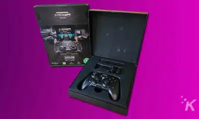 MOGA XP-Ultra game controller with packaging on purple background.
