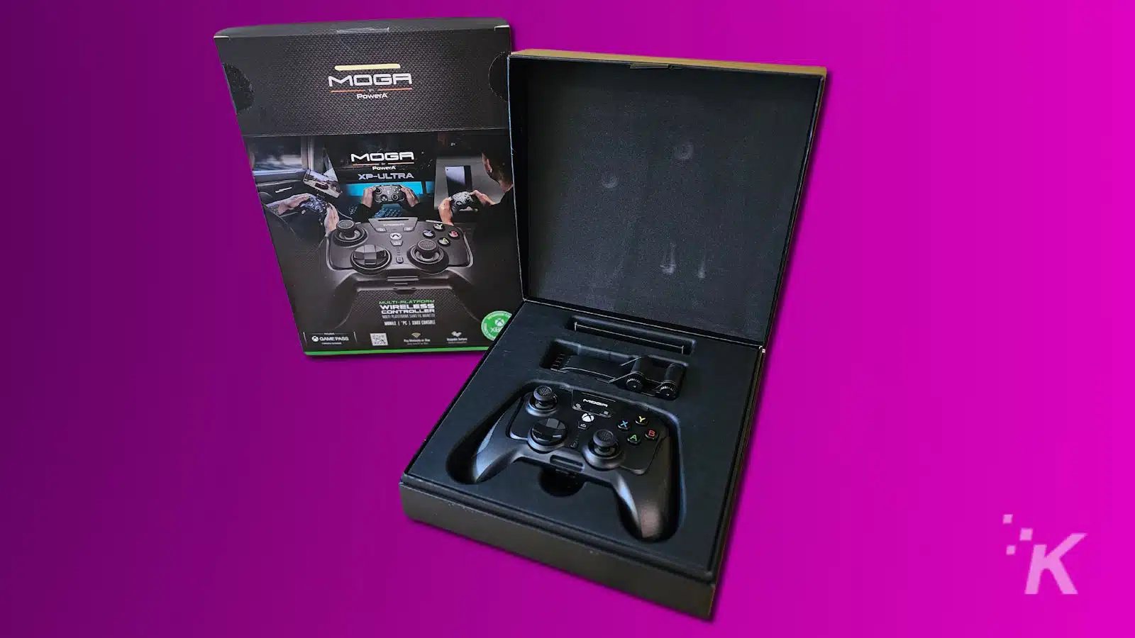 MOGA XP-Ultra game controller with packaging on purple background.