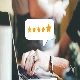 Customer ratings on a laptop while someone is typing