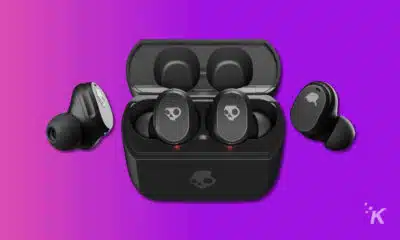 skullcandy mod tws earbuds and case on a purple background