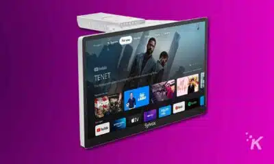 Smart TV displaying Google TV interface on purple background.