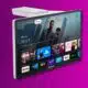 Smart TV displaying Google TV interface on purple background.
