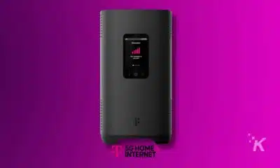 5G home internet router on purple background.