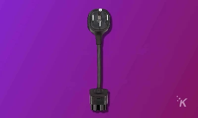 a tesla nema 14-50 adapter on a purple background