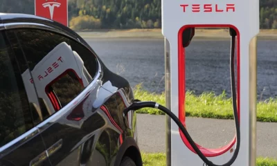 tesla car charging at charging station