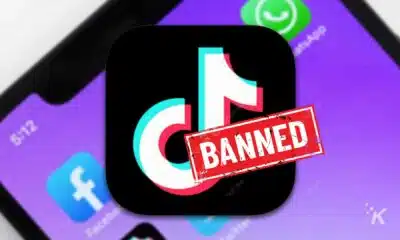 TikTok app icon with 'BANNED' stamp on smartphone screen.