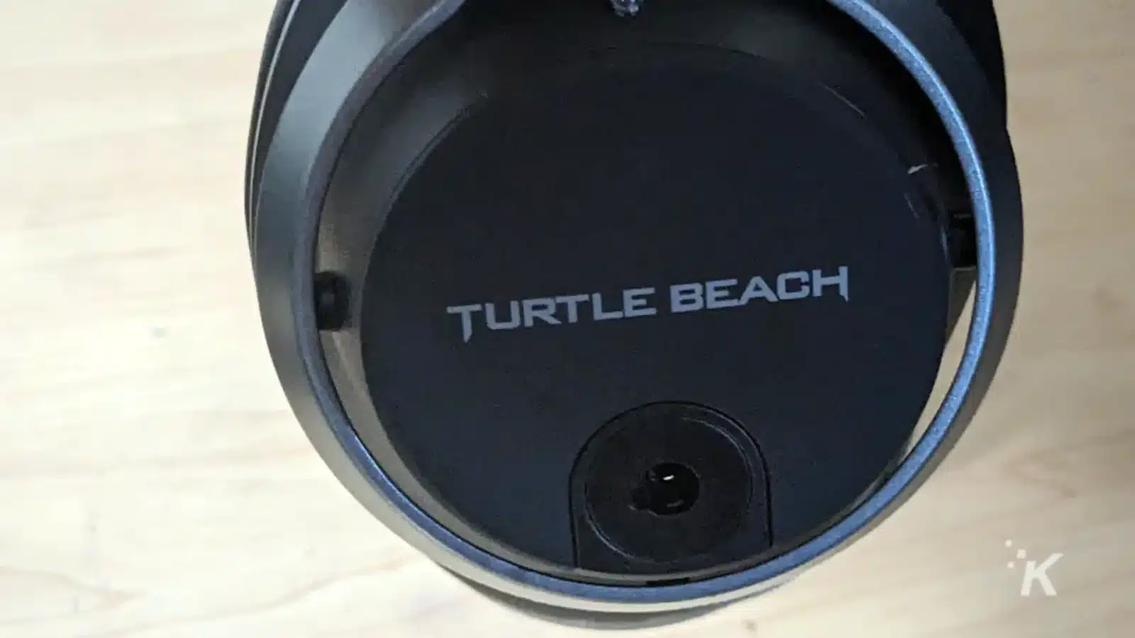 A circular lens sits atop a Turtle Beach K headset.
