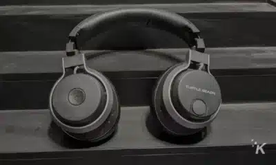 A pair of Turtle Beach headphones with a headset and ear pads are connected to audio equipment for a comfortable listening experience.