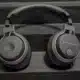A pair of Turtle Beach headphones with a headset and ear pads are connected to audio equipment for a comfortable listening experience.