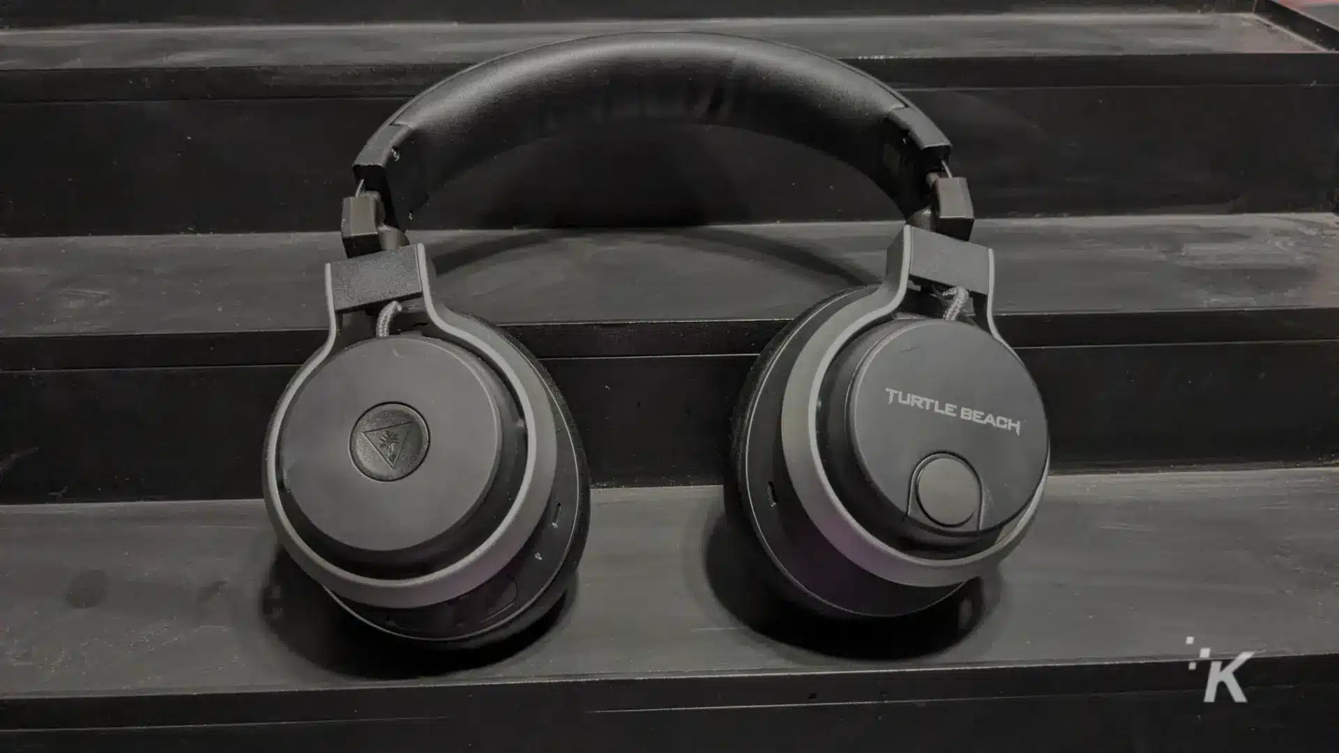 A pair of Turtle Beach headphones with a headset and ear pads are connected to audio equipment for a comfortable listening experience.
